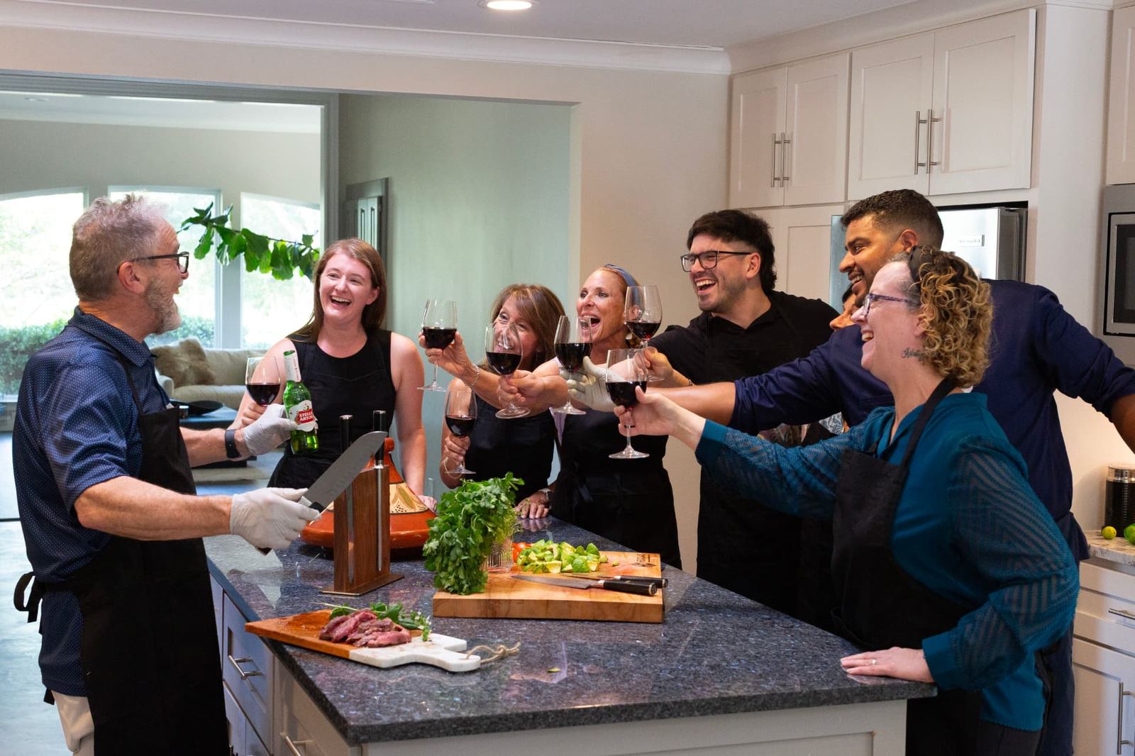 Friends raising a toast during a private cooking experience with Chef Youssef